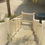 Tan-Closed-Picket-Stair-Vinyl-Railing-500x640