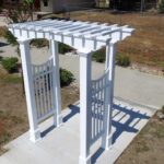 Vinyl-Devonshire-Arbor-with-Curved-Picket-Siding-500x640